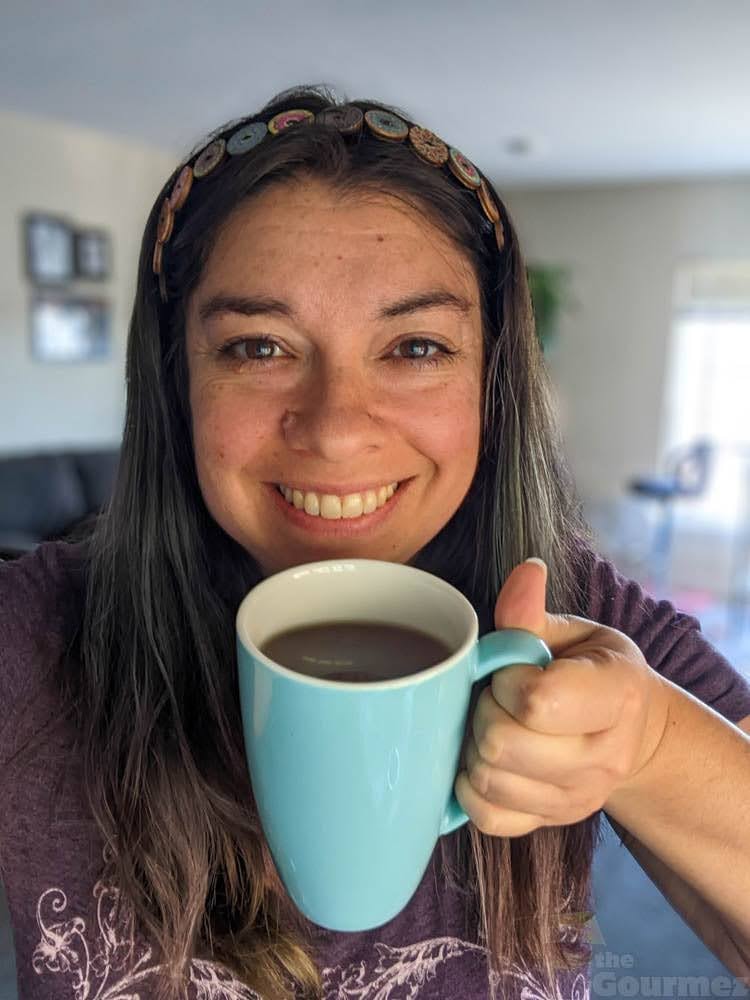 About Becca Becca drinking a cup of coffee
